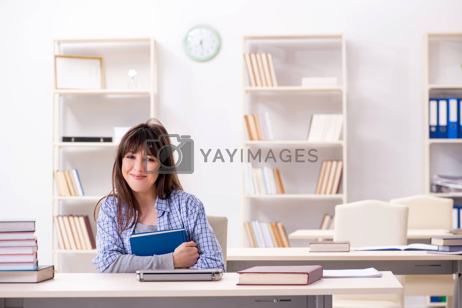 Royalty free image of Young female student in educational concept by Elnur