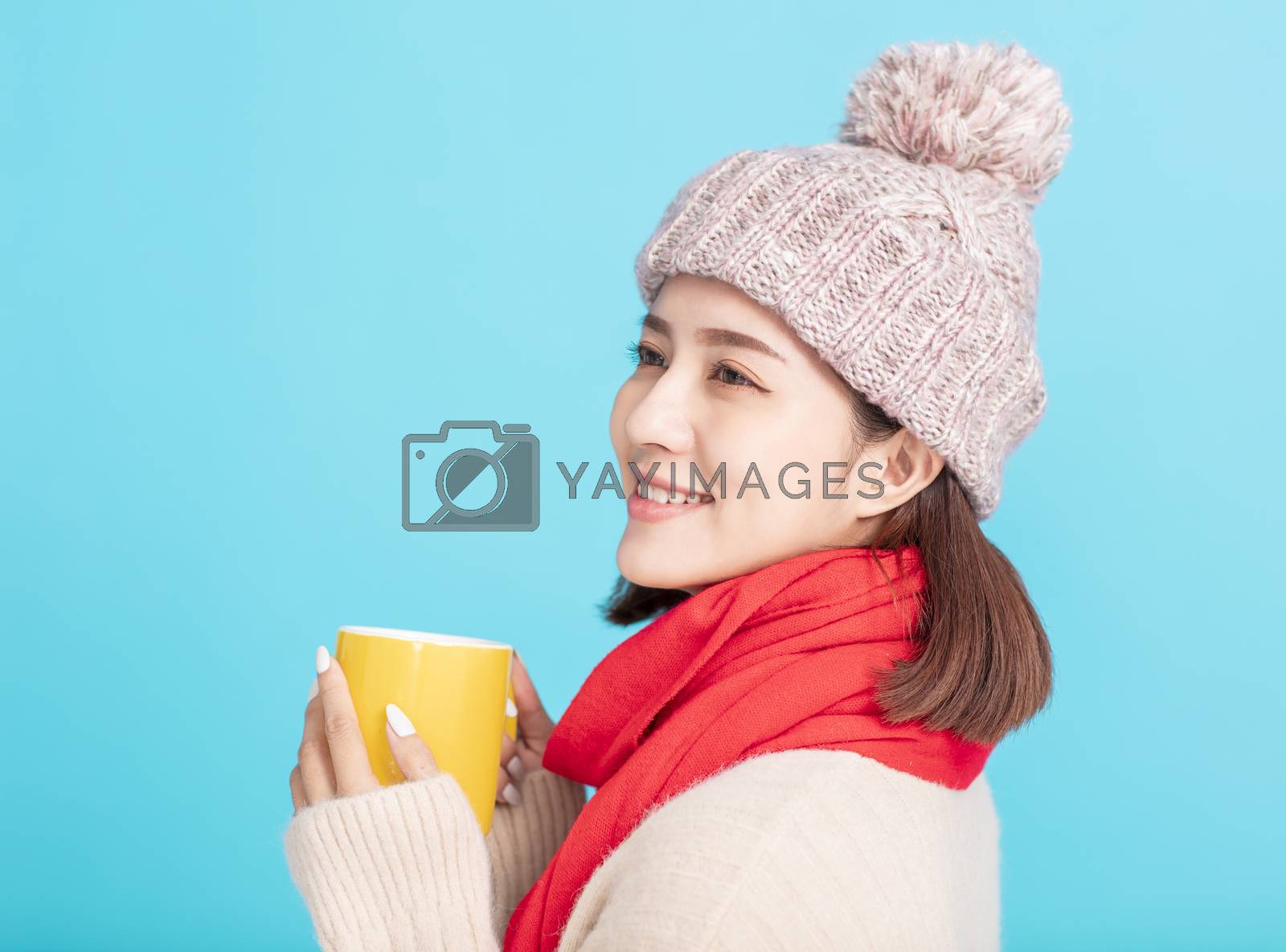 Royalty free image of young woman Enjoying a Cup of Hot Tea in Hands by tomwang