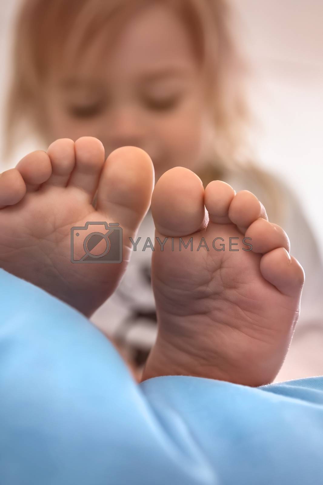 Photo of a Toddlers Feet. Baby after Waking up. Peaceful time at home.