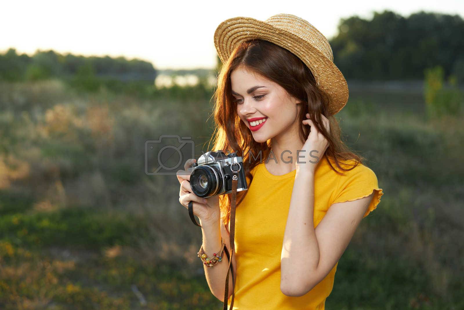 Pretty woman in hat photographer hobby lifestyle summer nature. High quality photo