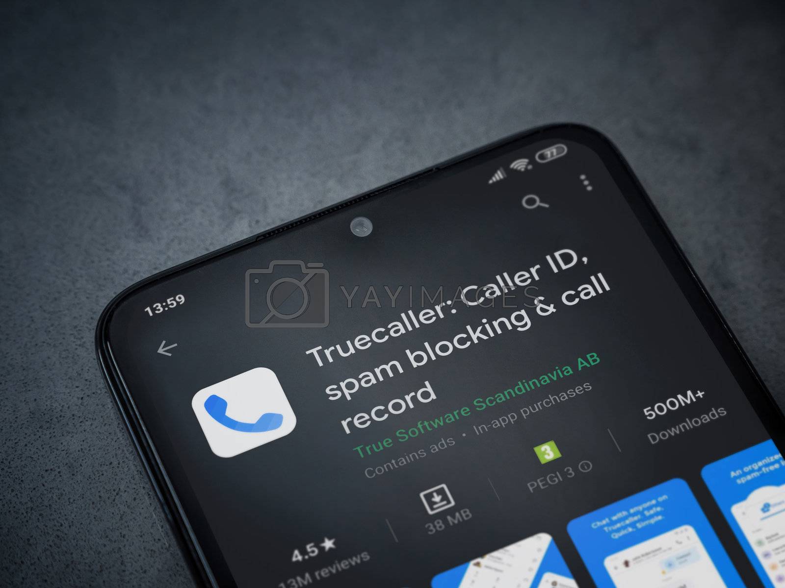 Royalty free image of Truecaller app play store page on the display of a black mobile  by wavemovies