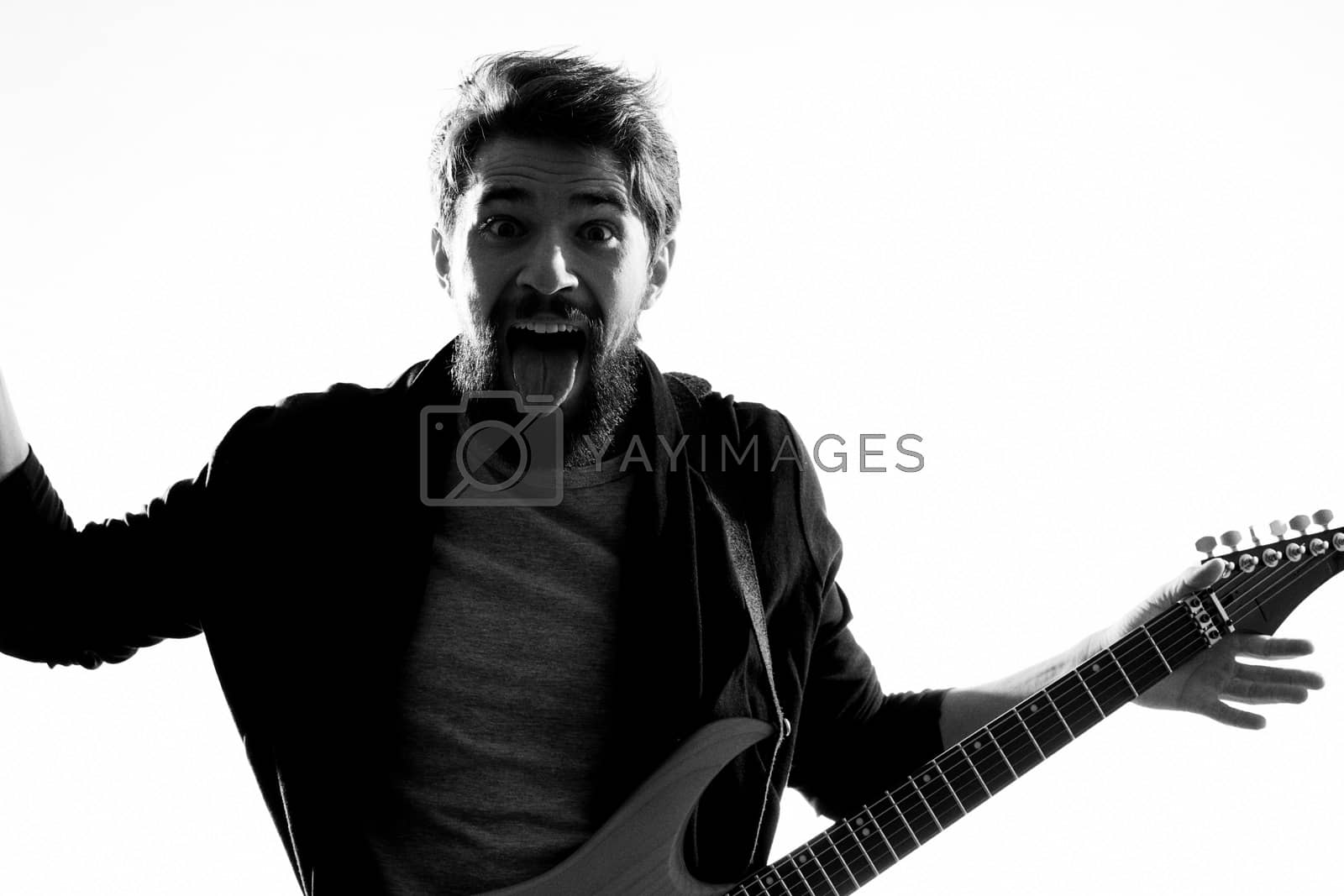 Royalty free image of Musician with guitar rock star emotions entertainment modern performer by SHOTPRIME