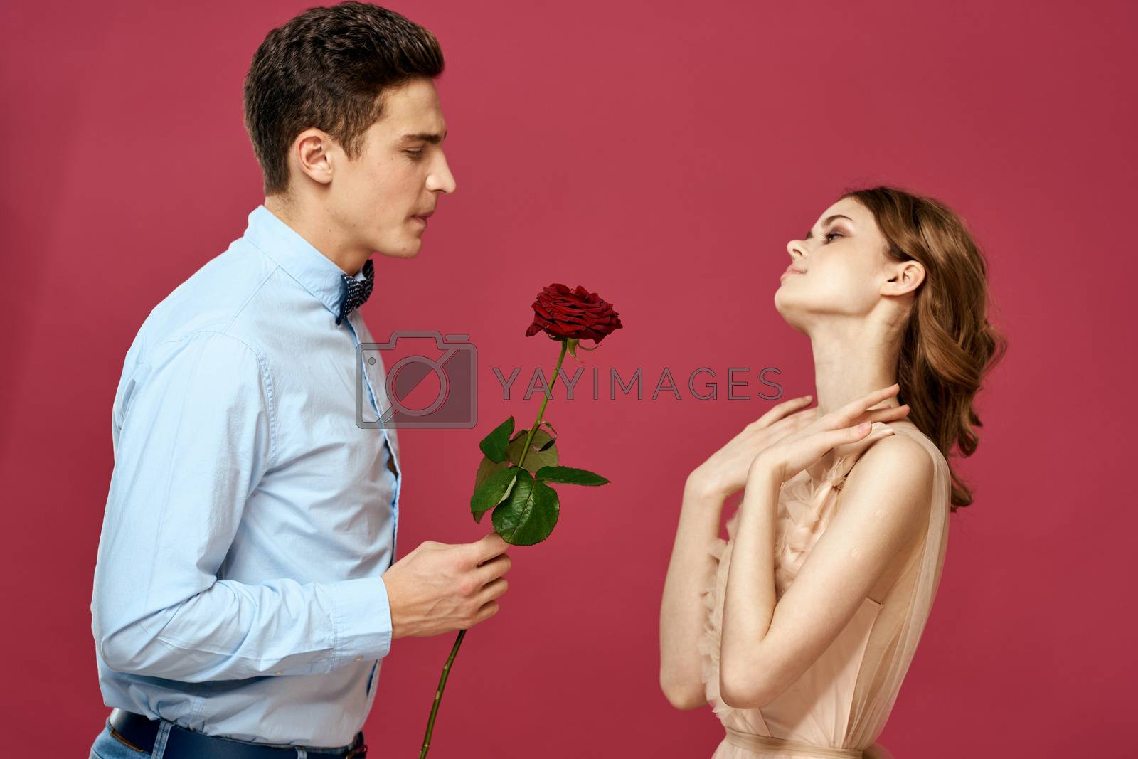 married couple man and woman romance red rose isolated background holiday flowers. High quality photo
