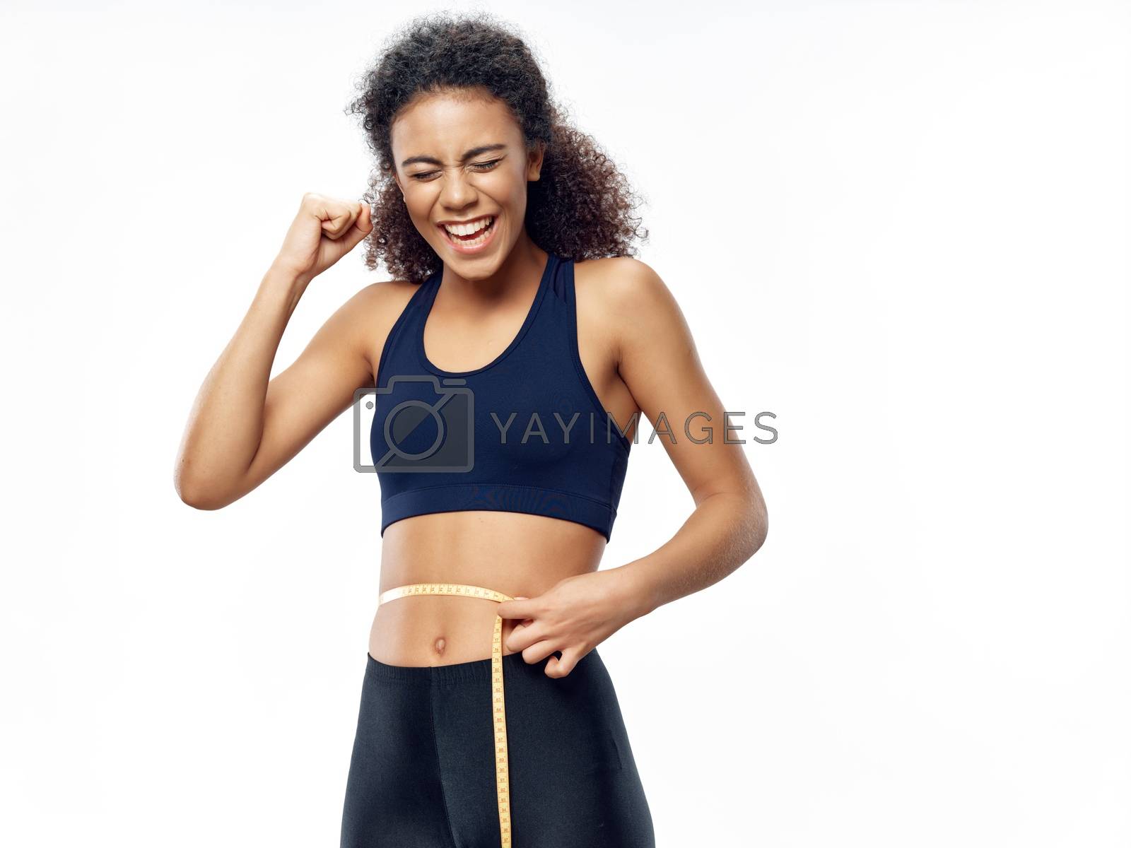 Sportive woman with centimeter tape and diet sport fitness calories
