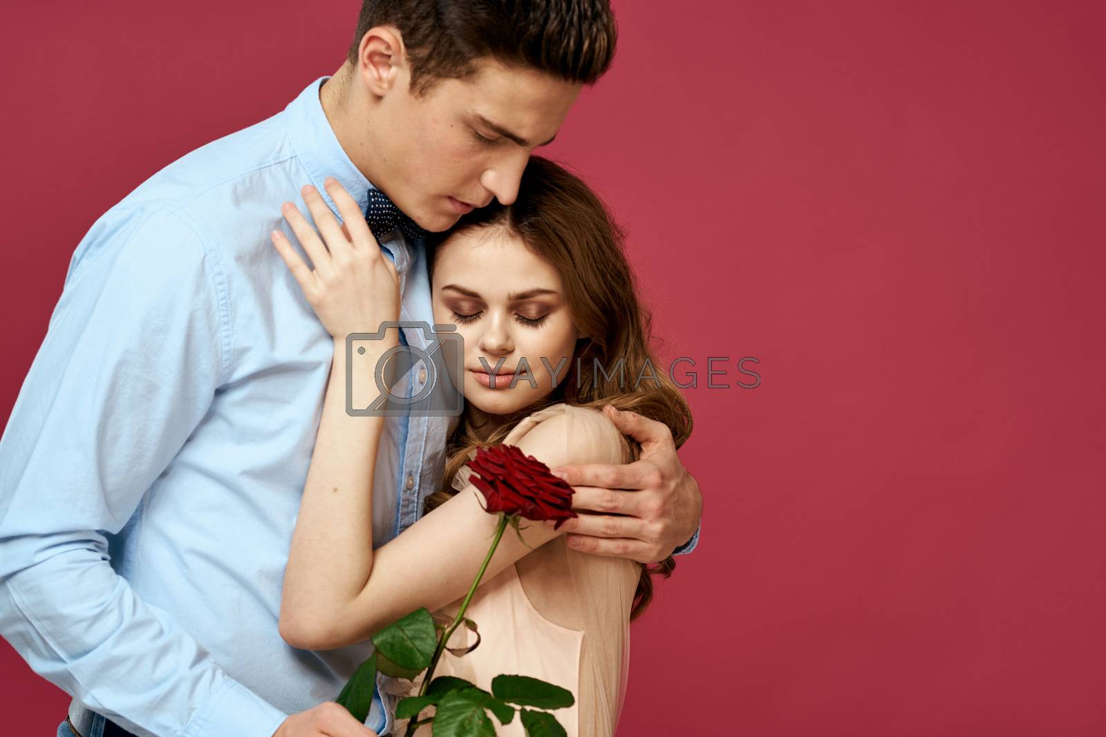married couple man and woman romance red rose isolated background holiday flowers. High quality photo