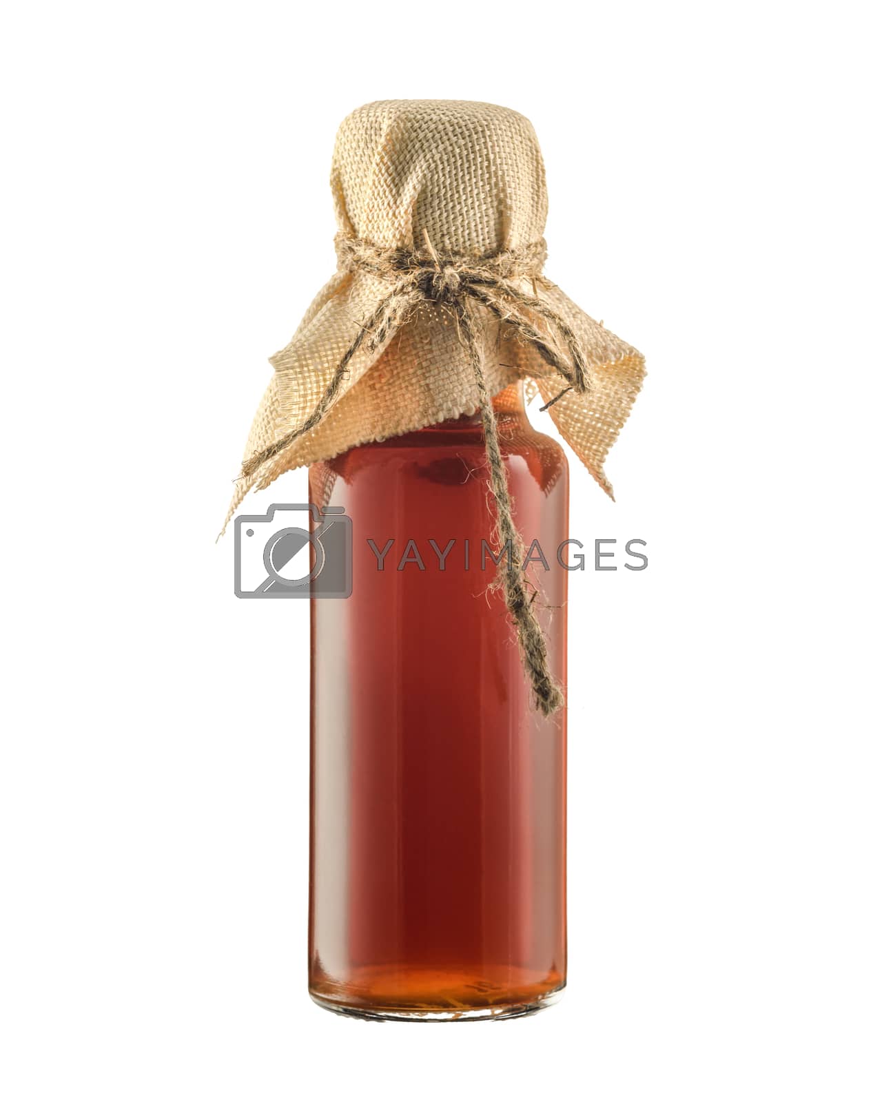 Royalty free image of Glass bottle with syrup isolated on a white background by VladimirZubkov