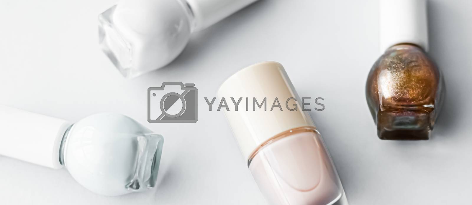 Royalty free image of Nail polish bottles on white background, beauty brand by Anneleven