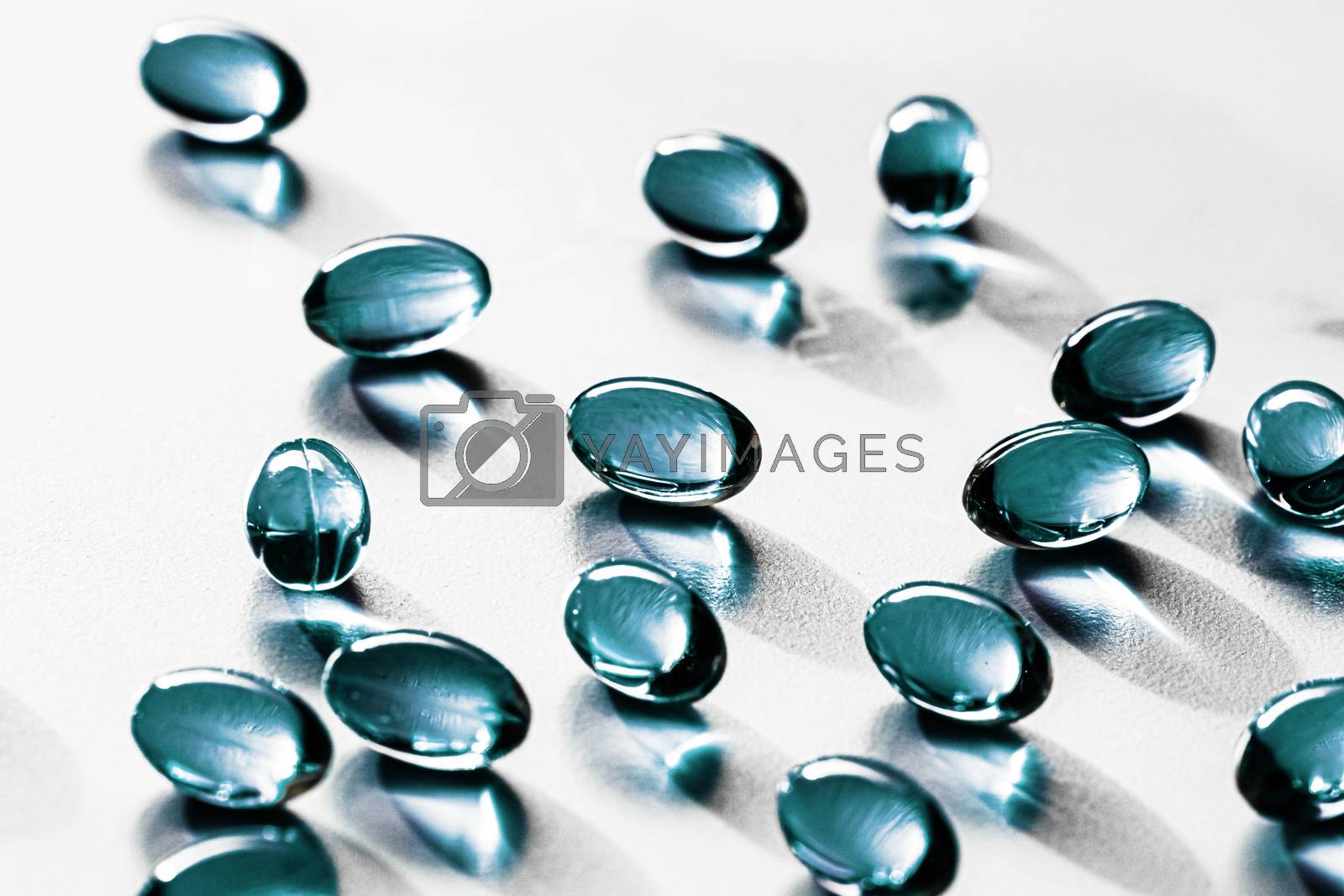 Royalty free image of Blue capsules for healthy diet nutrition, pharma brand store, pr by Anneleven