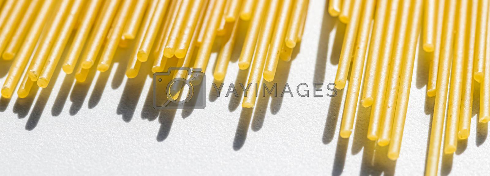 Royalty free image of Uncooked whole grain spaghetti closeup, italian pasta as organic by Anneleven