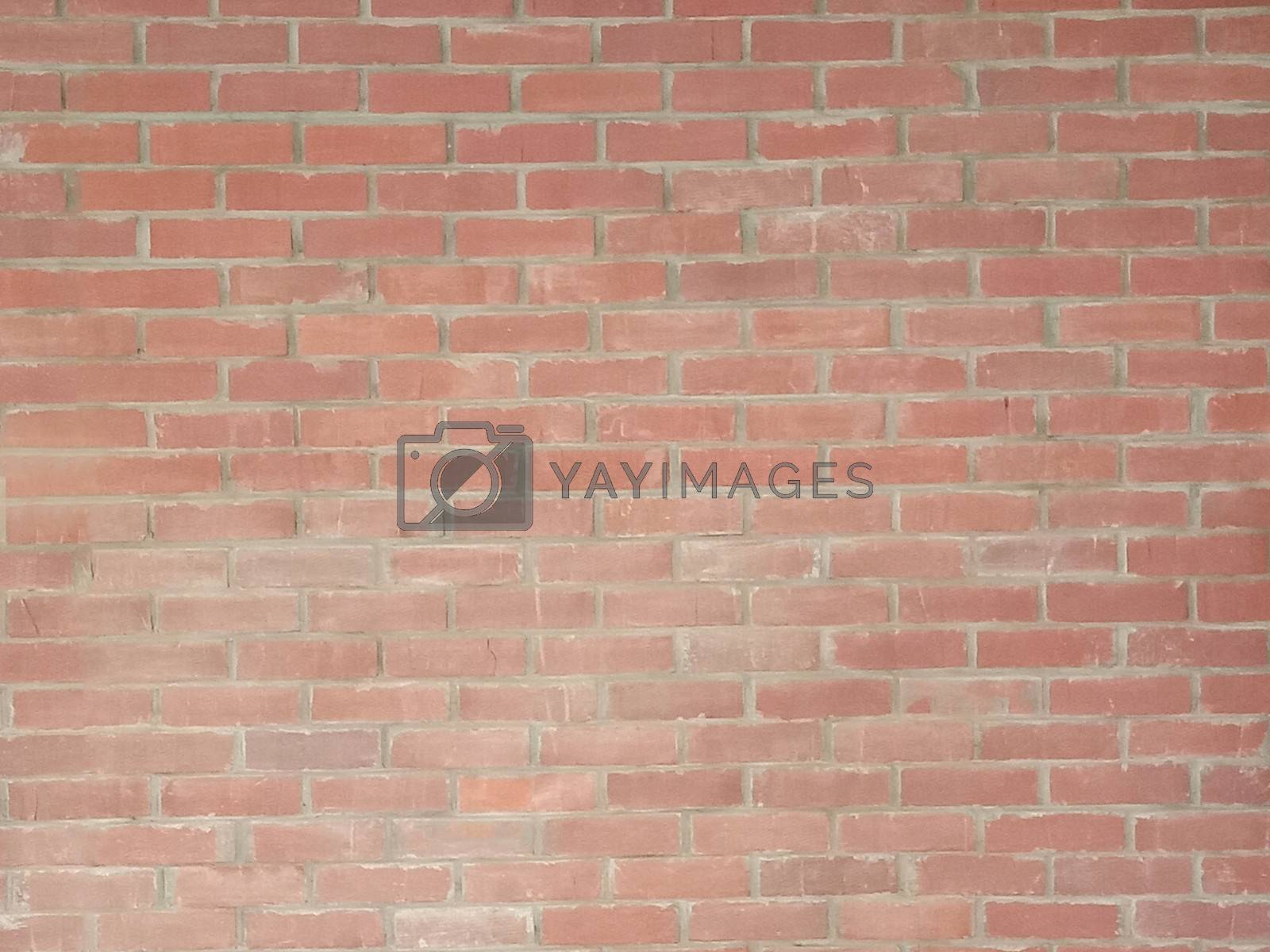 Royalty free image of red colored bricks wall closeup by jahidul2358