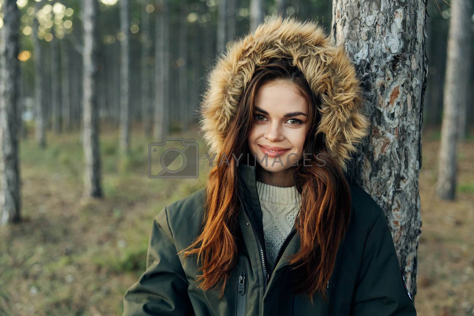 woman outdoors in the forest autumn vacation travel. High quality photo