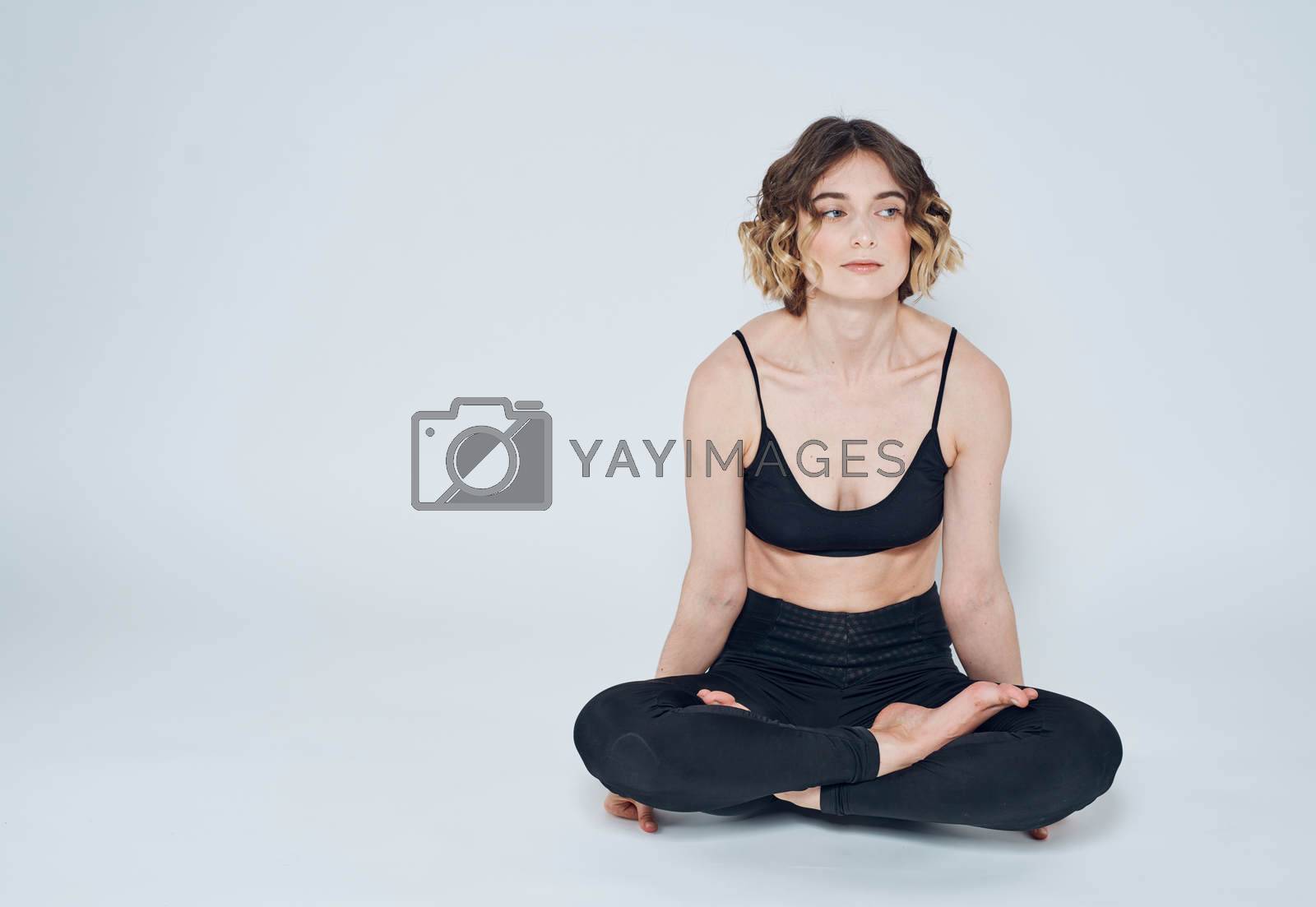 Meditation yoga woman asana light background crossed legs. High quality photo