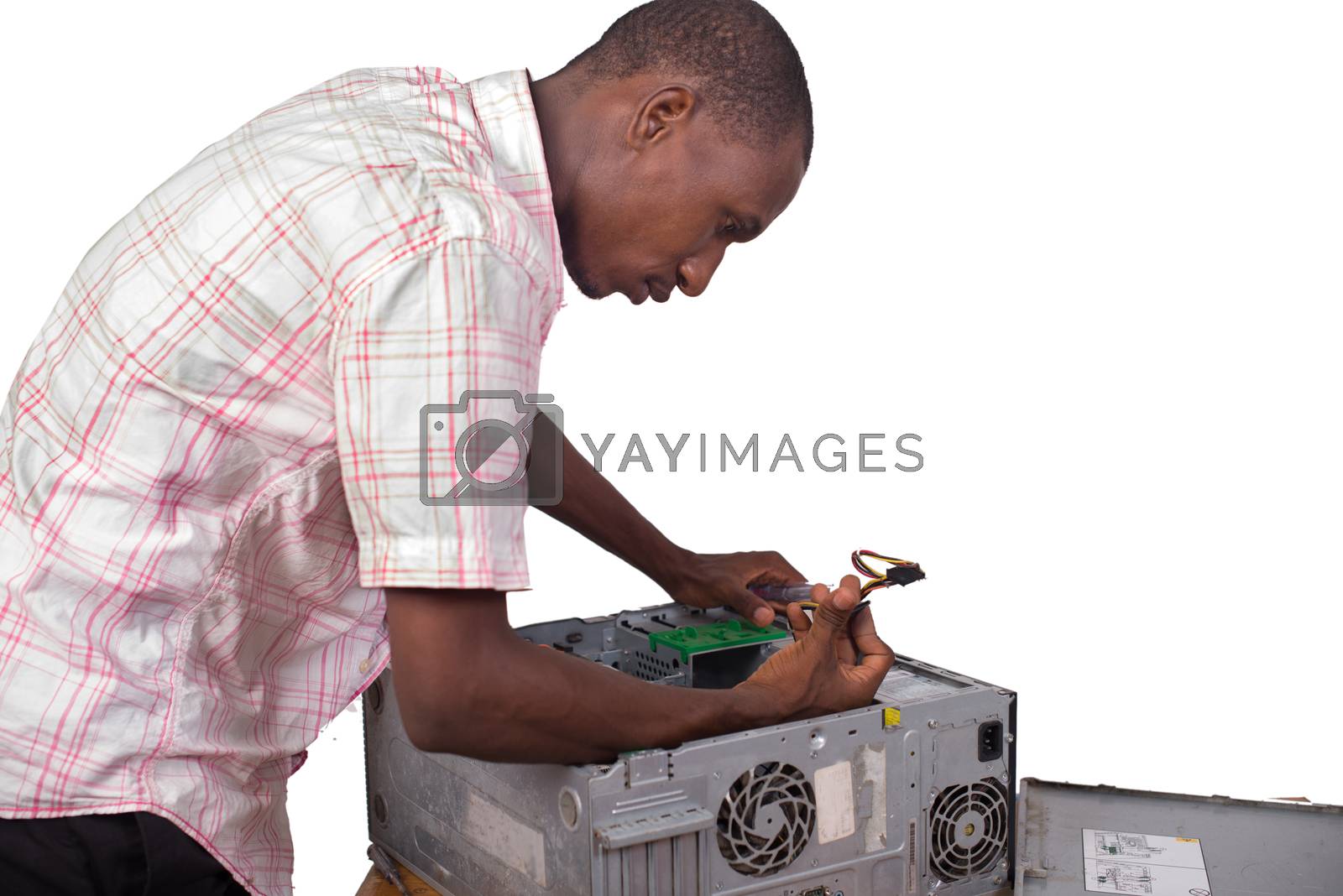 Royalty free image of Technician fixing the computer in the office by vystek