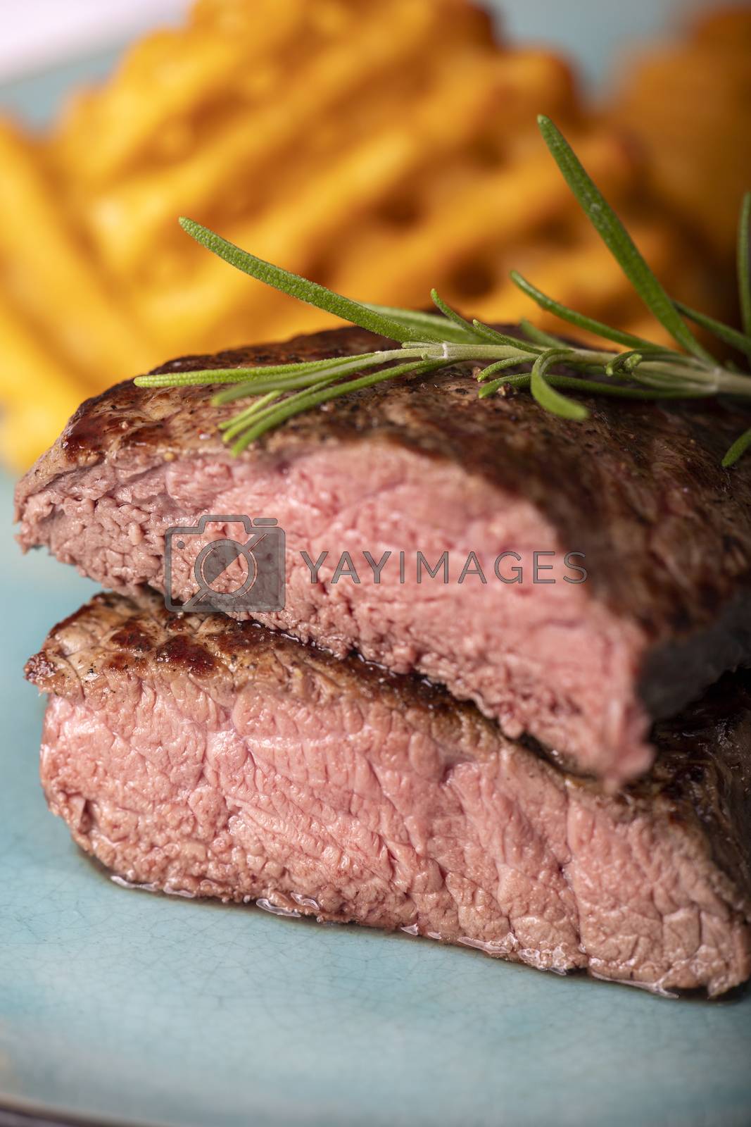 Royalty free image of steak with potato lattices by bernjuer