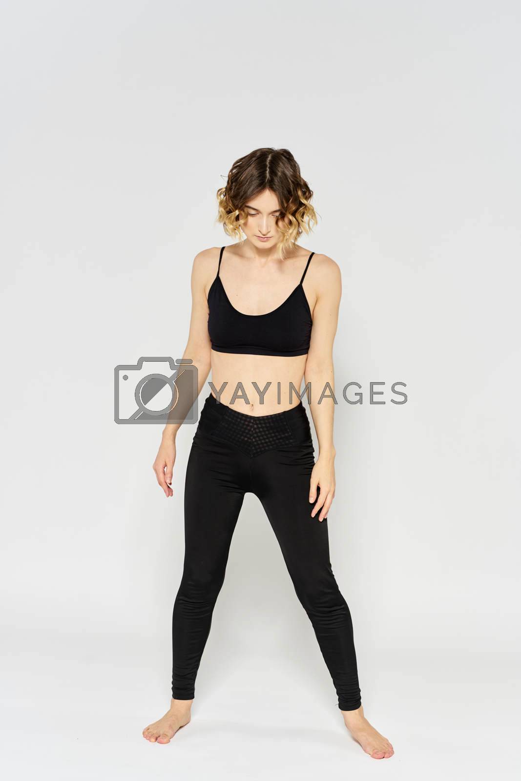 Yoga asana sport woman fitness light background leggings model. High quality photo
