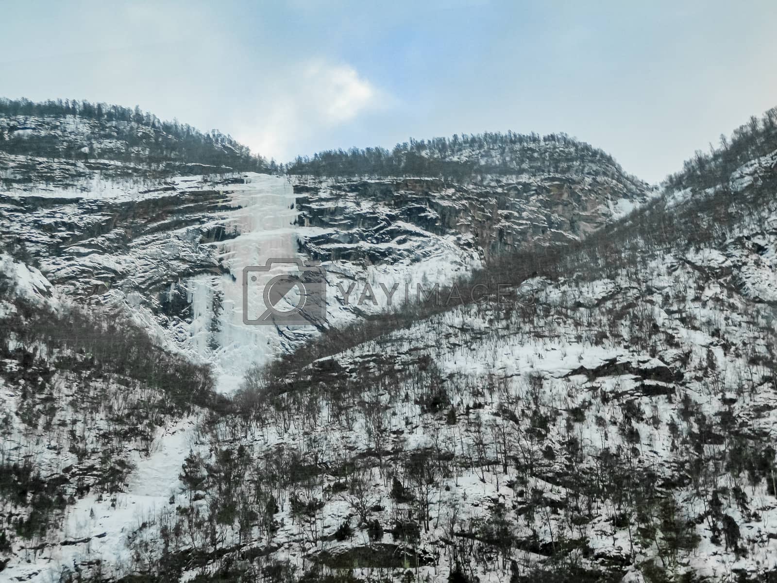 Royalty free image of Frozen waterfall and icicles in a beautiful landscape in Norway. by Arkadij