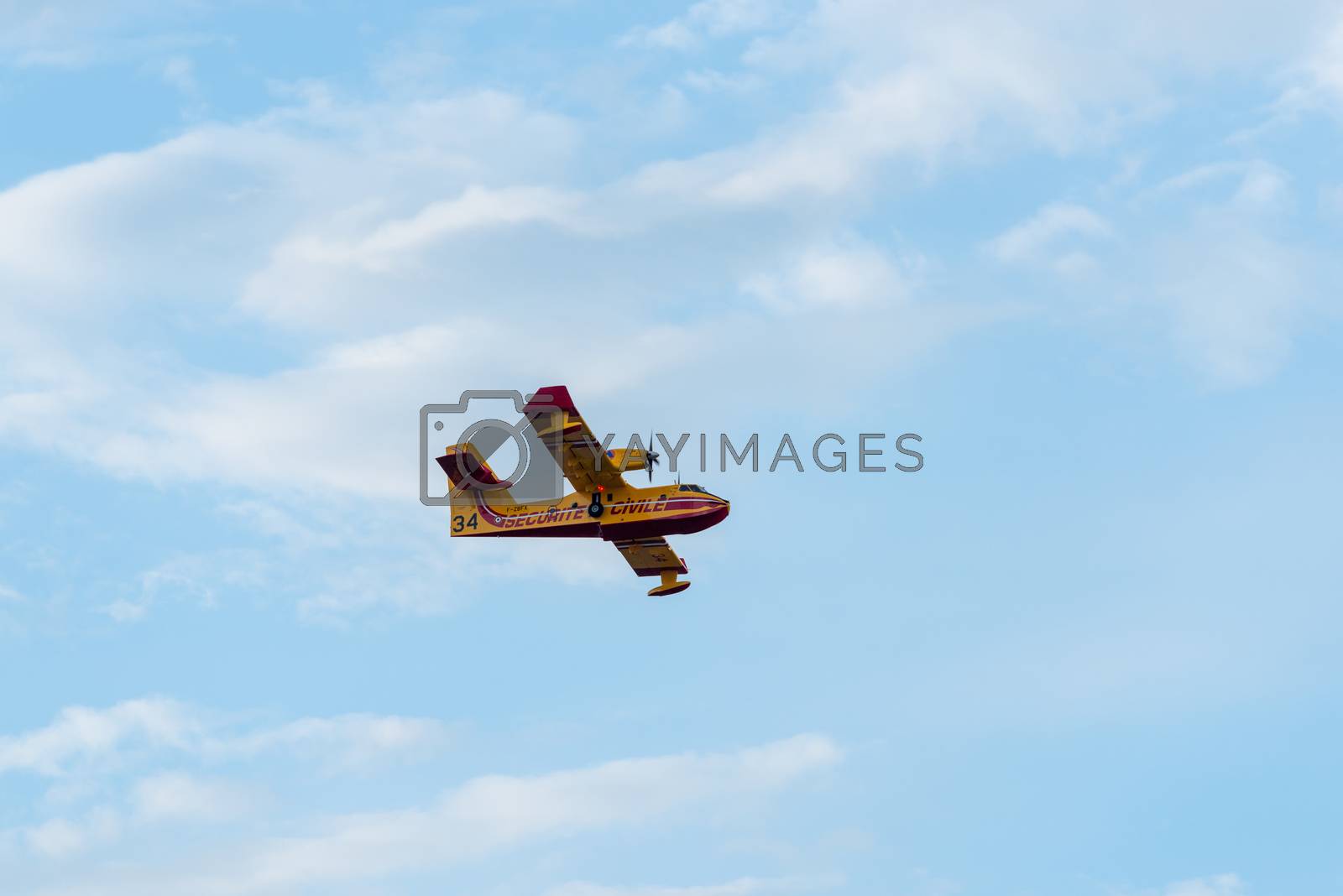 Royalty free image of Canadair CL-415 amphibious water bomber in flight by dutourdumonde