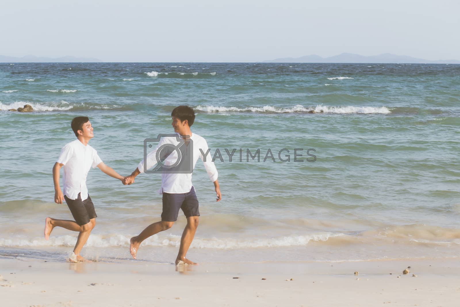 Royalty free image of Homosexual portrait young asian couple running with cheerful tog by nnudoo