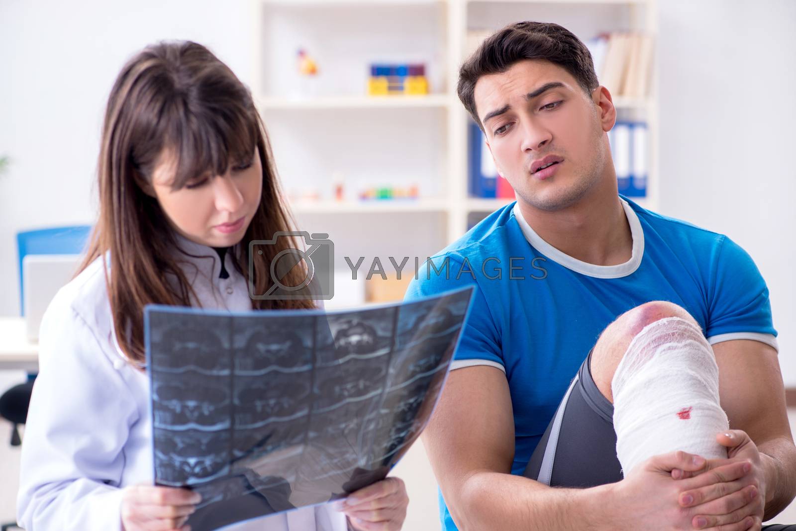 Royalty free image of Sports player visiting doctor after injury by Elnur