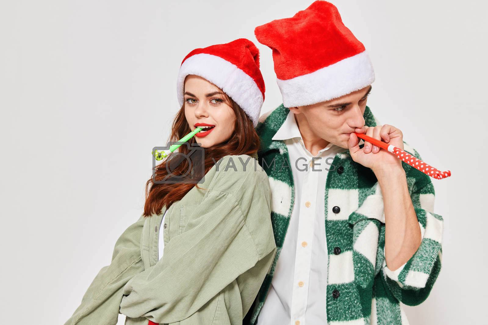 man and woman with festive horns fun christmas holiday together romance. High quality photo