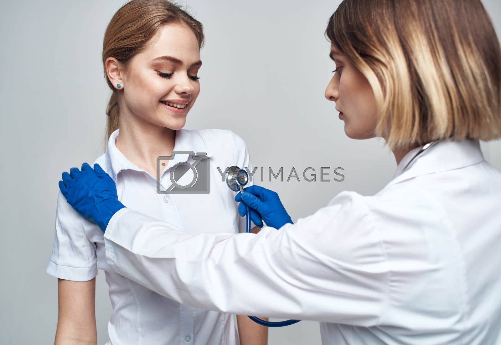 female doctor in blue gloves injection syringe communication patient. High quality photo