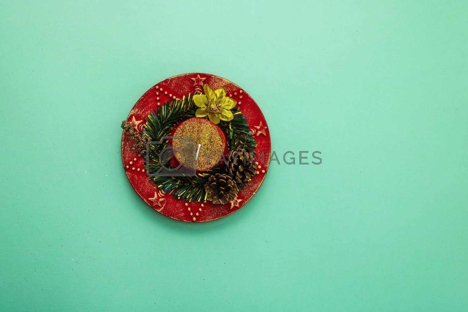Royalty free image of  Decorated christmas red candle top view . Christmas composition by vladispas