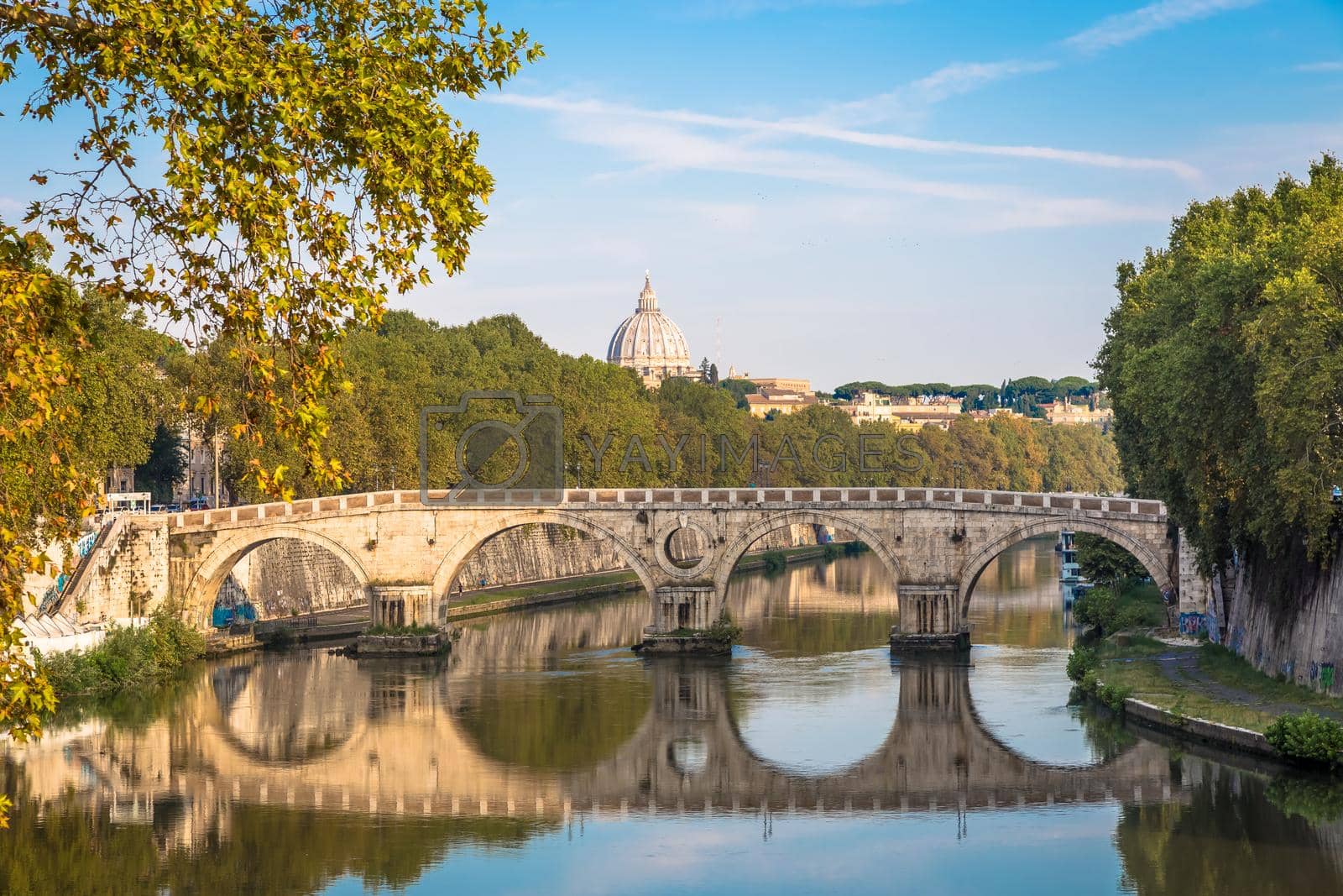 Royalty free image of Bridge on Tiber river in Rome, Italy. Vatican Basilica cupola in background with sunrise light. by Perseomedusa