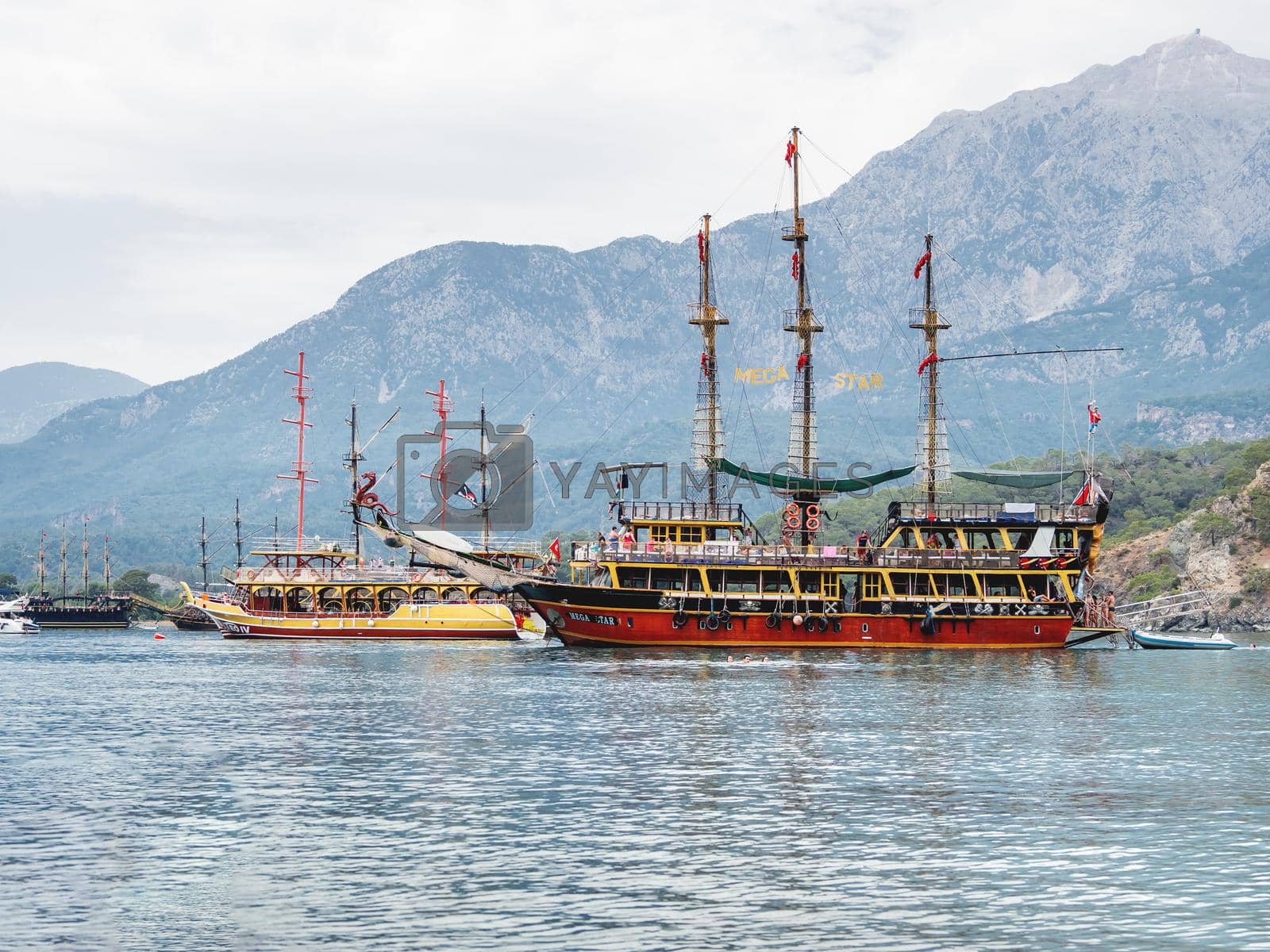 Royalty free image of PHASELIS, TURKEY - May 19, 2018. Touristic vintage yachts are moored at Phaselis harbour. Beautiful ships for tourist trips on the Mediterranean sea. by aksenovko