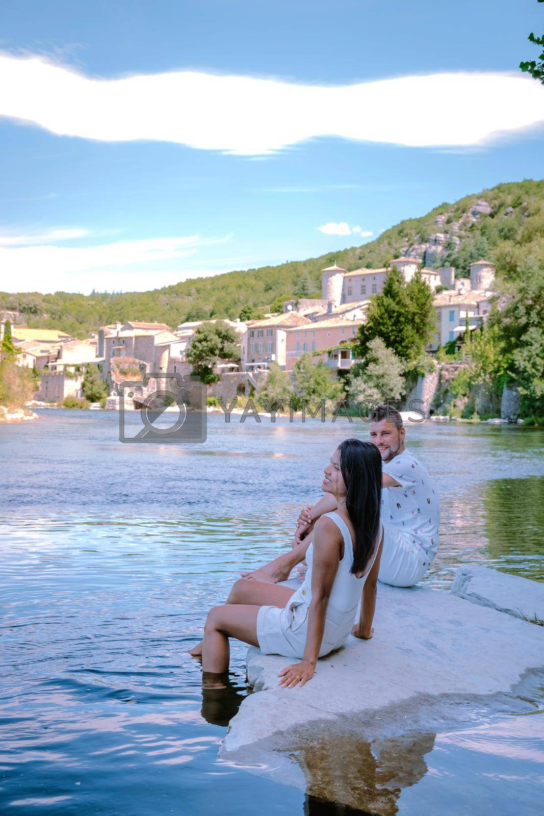 Royalty free image of couple on vacation in Ardeche France, view of the village of Vogue in Ardeche. France by fokkebok