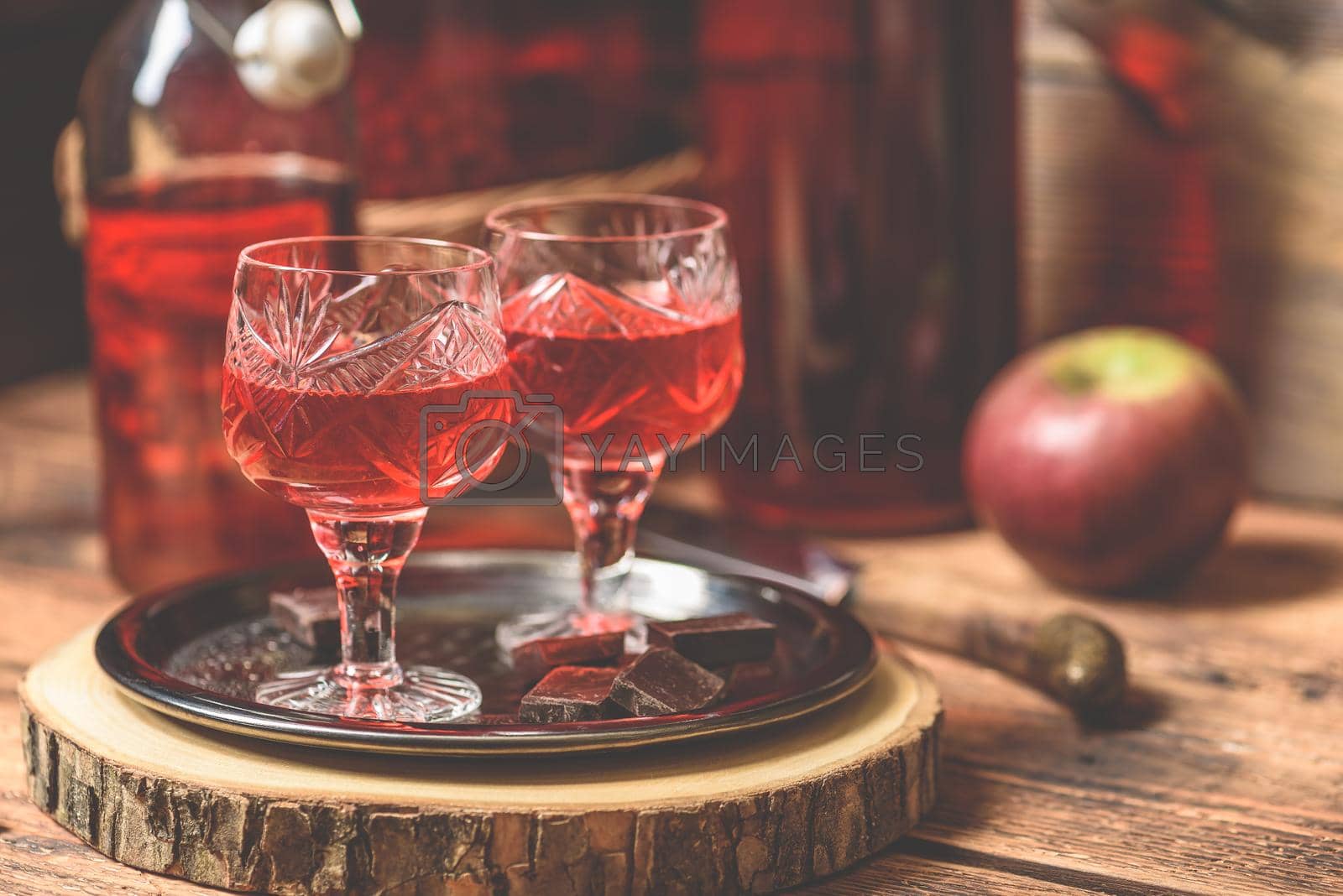Royalty free image of Homemade berry alcoholic beverage and chocolate by Seva_blsv