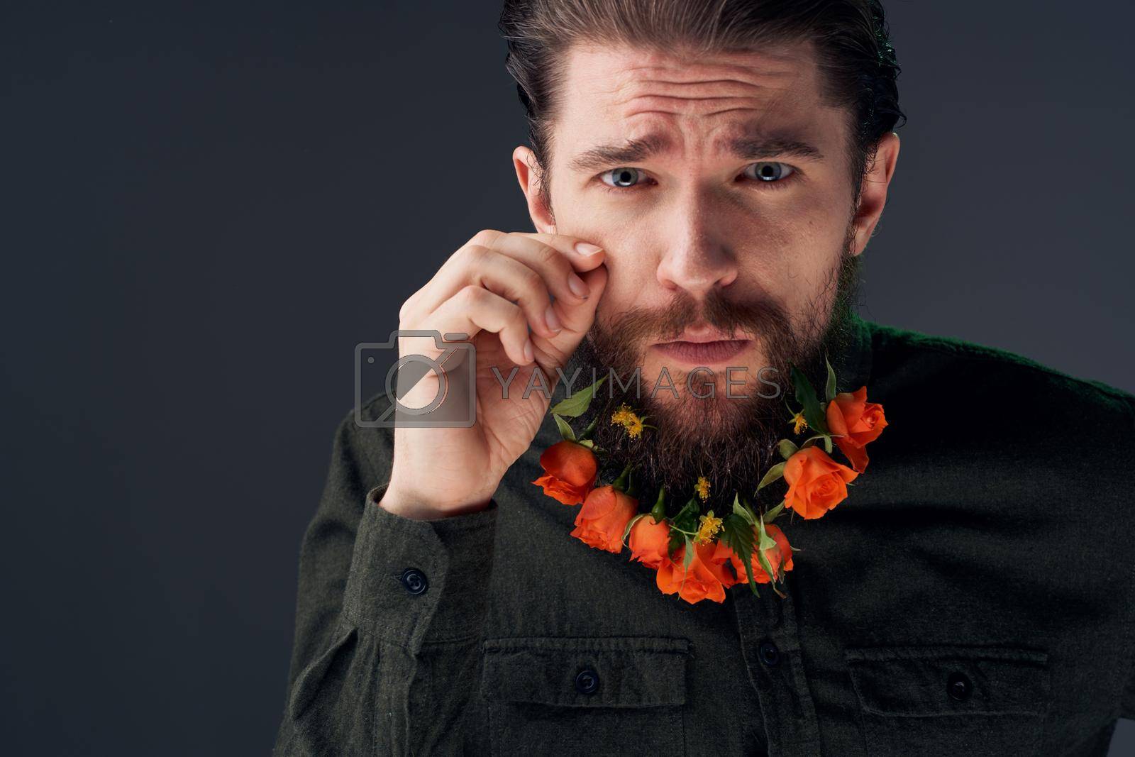 Bearded man with flowers decoration romance attractive look close-up. High quality photo