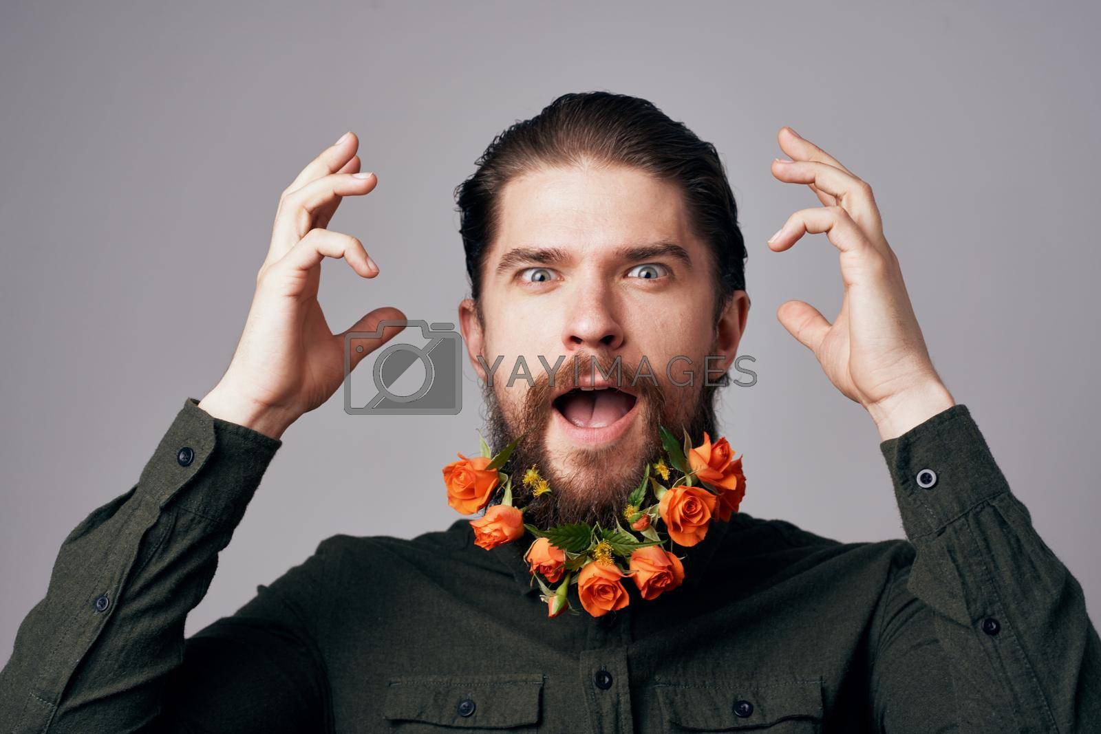 Cheerful man flowers in a beard holiday romance gift decoration. High quality photo
