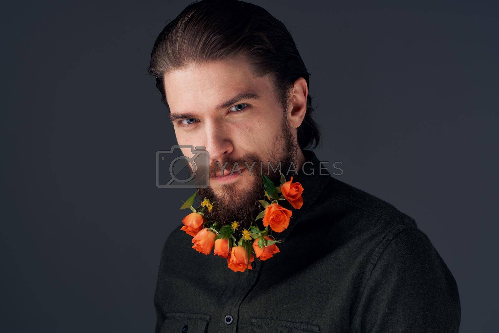 Cute man decorating in the city flowers romance gift. High quality photo
