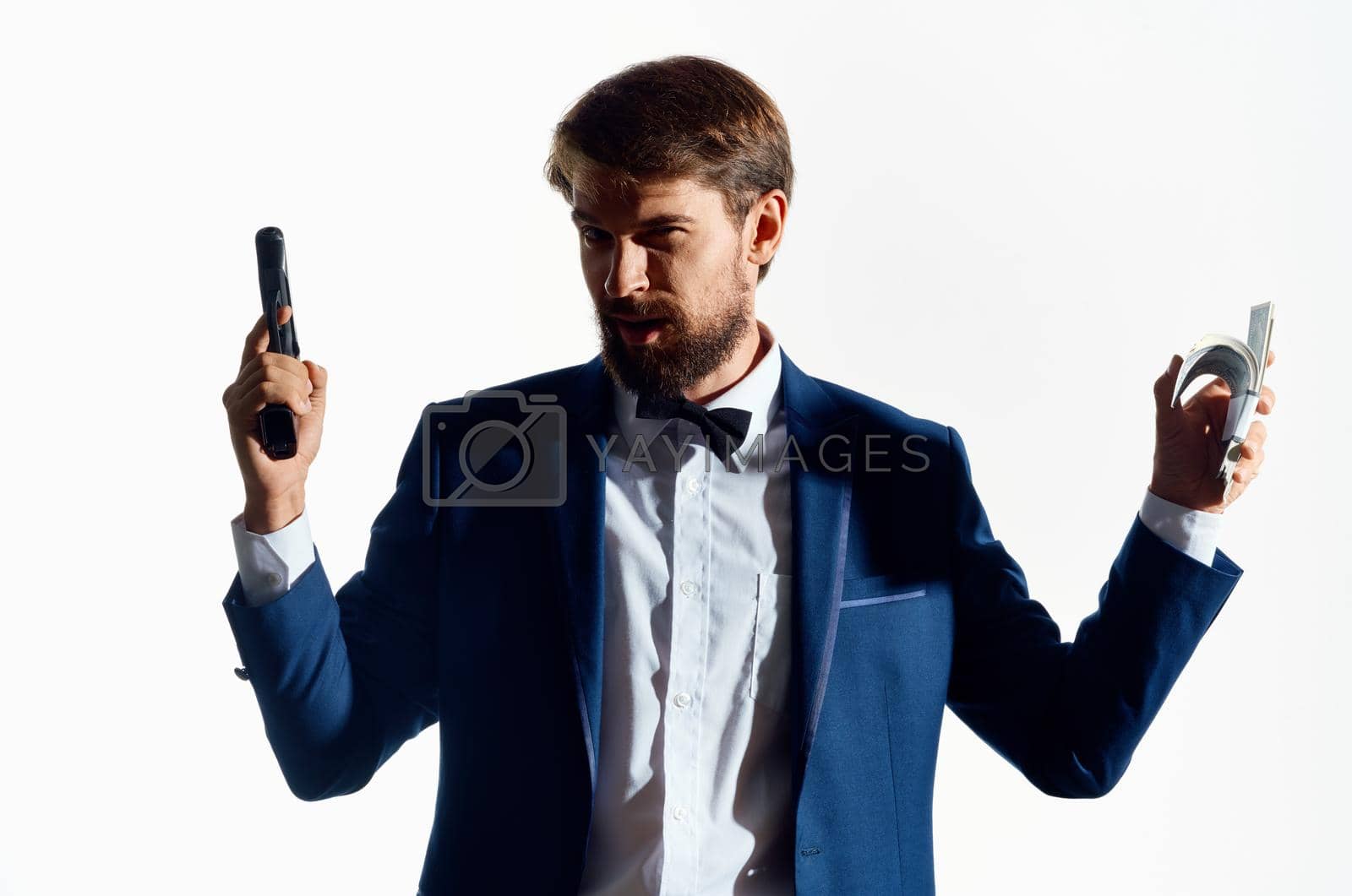 Royalty free image of man in suit gun money gangster business light background by SHOTPRIME