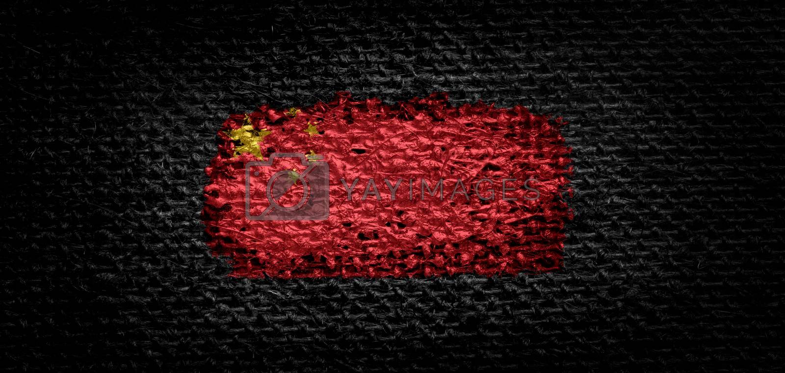 Royalty free image of National flag of the China on dark fabric by butenkow