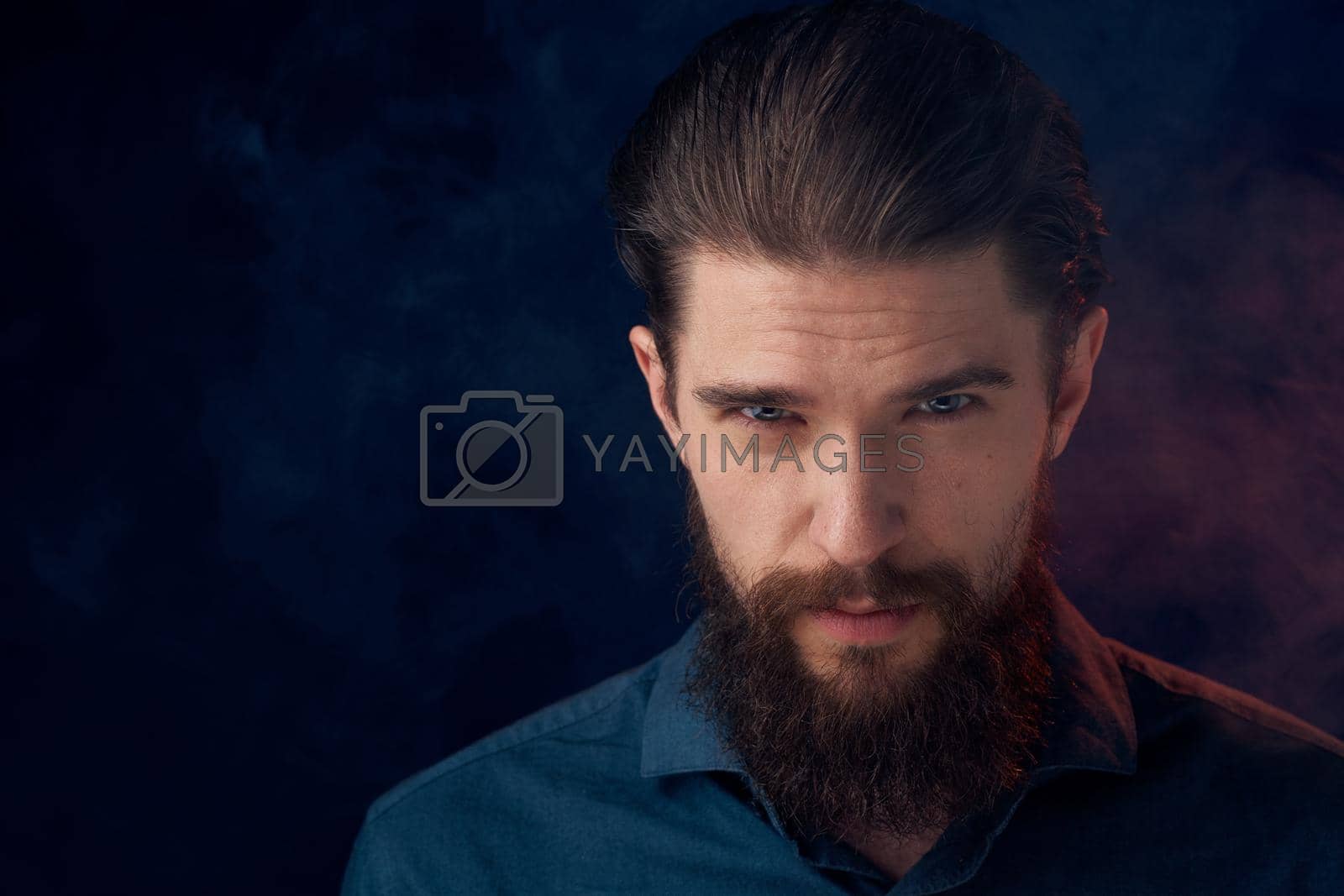Royalty free image of Cute bearded man in shirt elegant style close-up dark background by SHOTPRIME