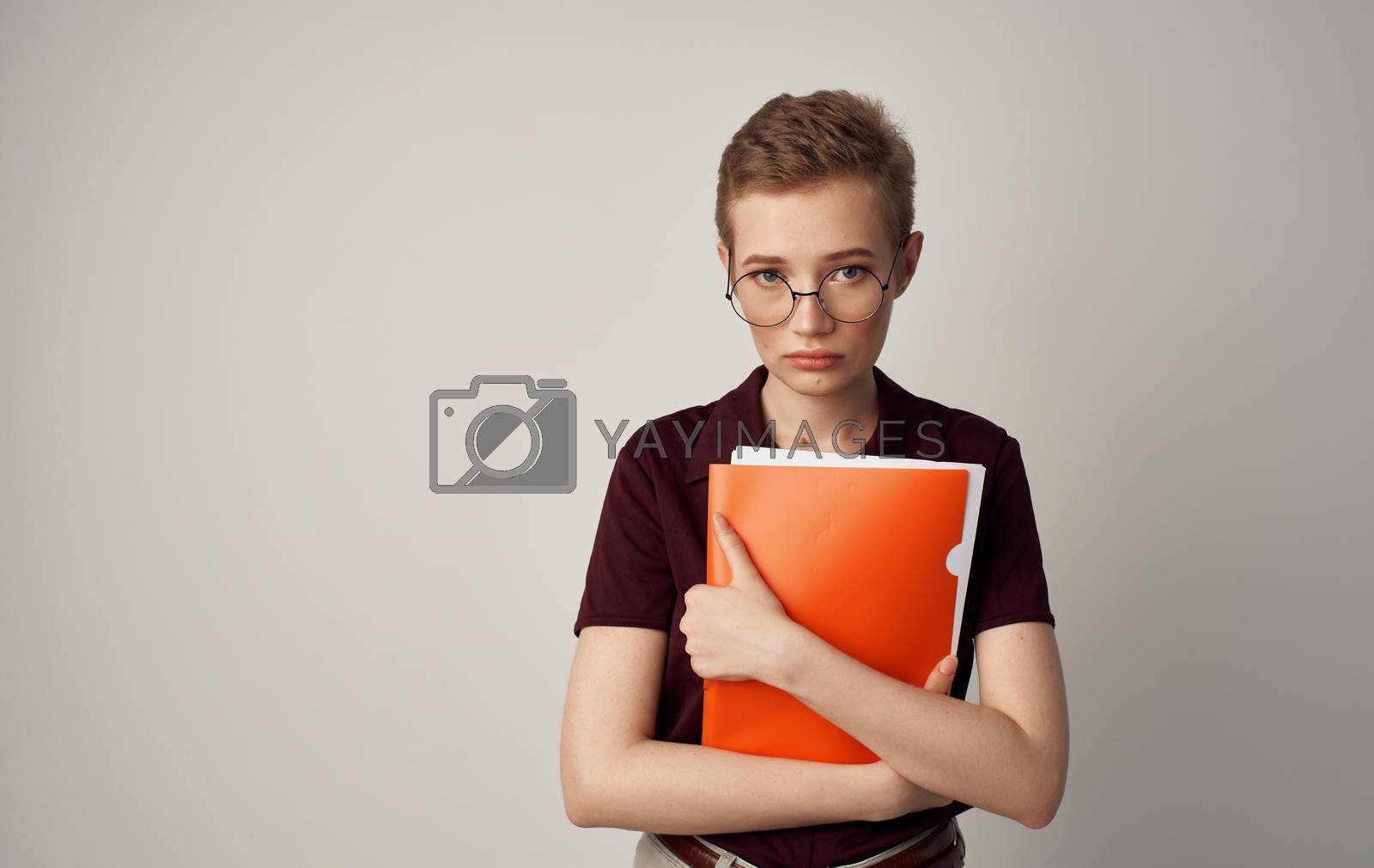 Royalty free image of Pretty business woman with short hair documents self confidence by SHOTPRIME