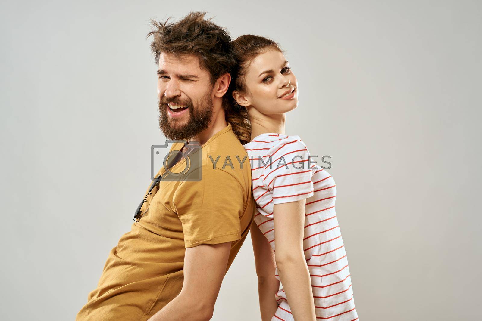 Young couple socializing romance lifestyle fashion fun light background. High quality photo