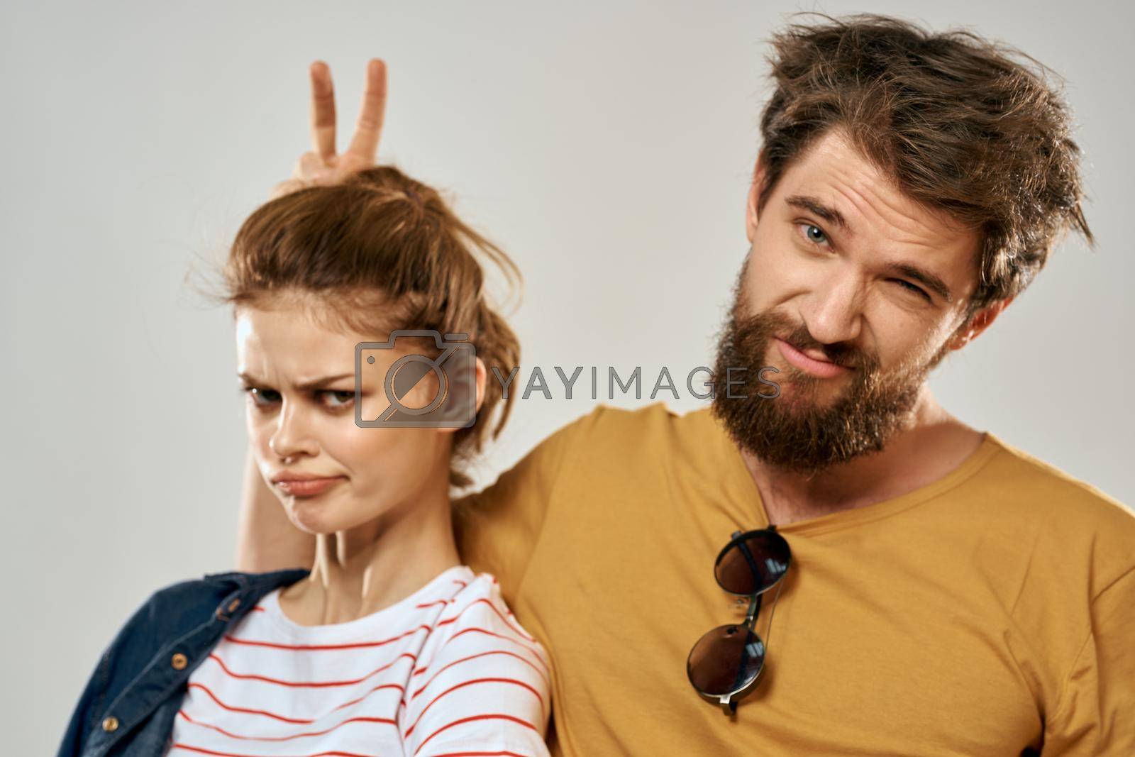 Young couple lifestyle emotions communication fashion light background. High quality photo