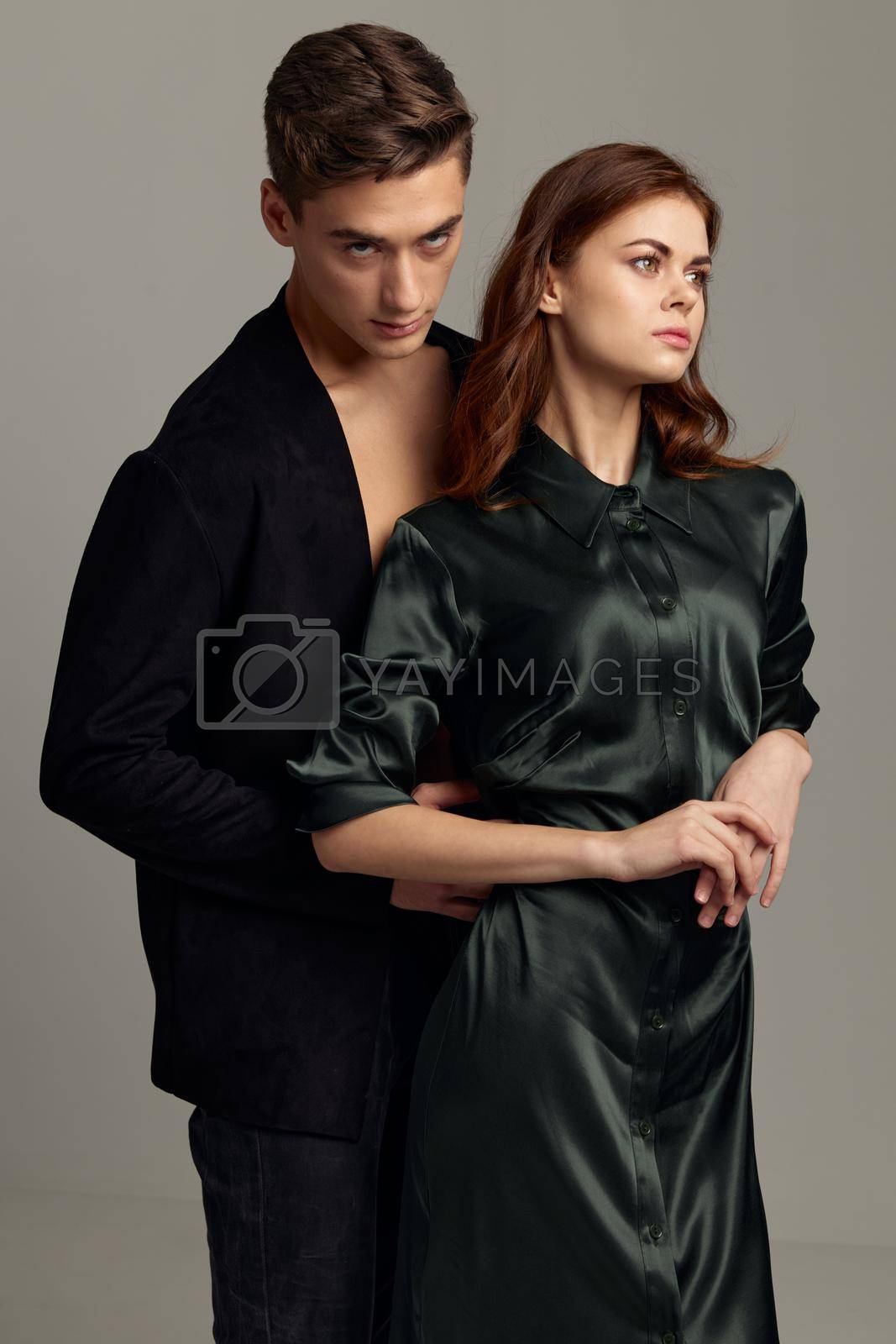 Man hugs woman from behind romance lifestyle attractiveness luxury studio. High quality photo