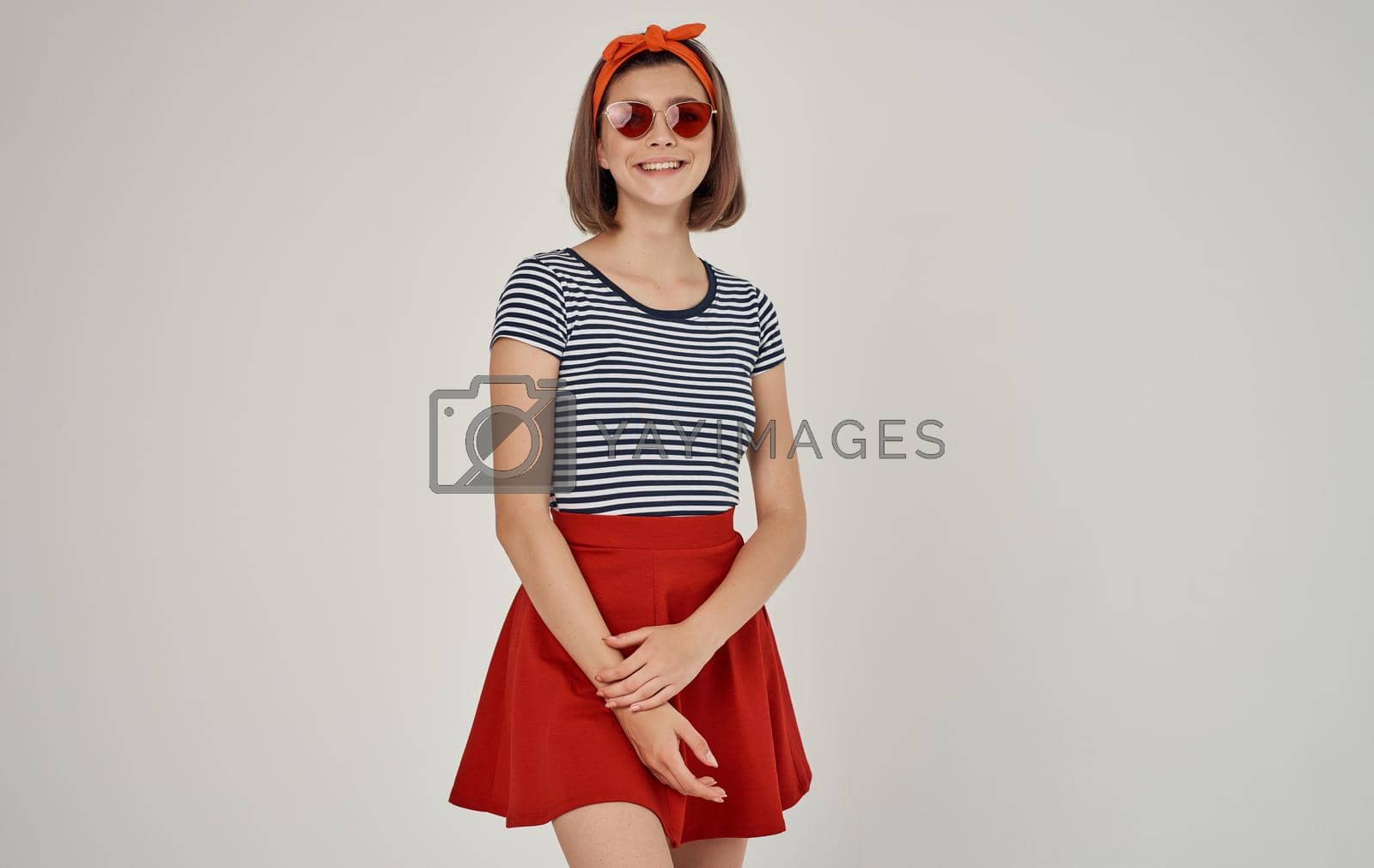 Royalty free image of pretty woman wearing sunglasses striped tshirt fashion modern style by SHOTPRIME