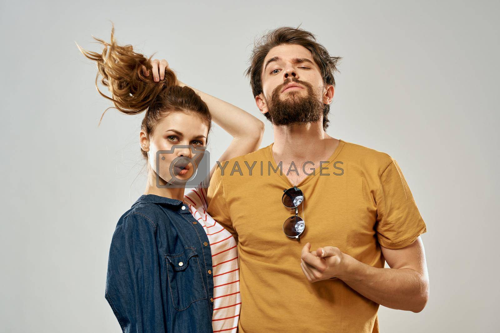Young couple lifestyle emotions communication fashion light background. High quality photo
