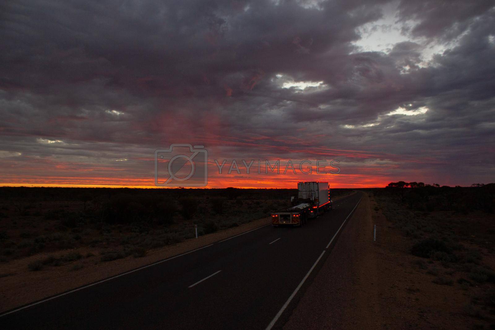 Royalty free image of Roadtrain on stuart highway at night. A roadtrain use in remote areas of Australia to move freight efficiently, NORTHERN TERRITORY,Australia. by bettercallcurry