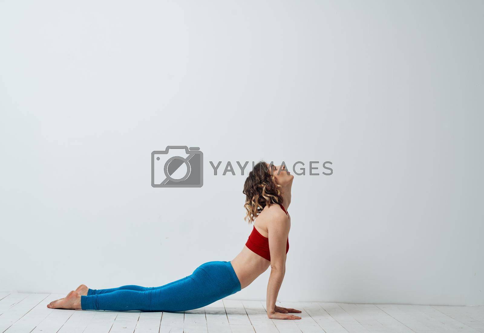Royalty free image of Woman doing gymnastics exercises yoga asana sportswear by SHOTPRIME