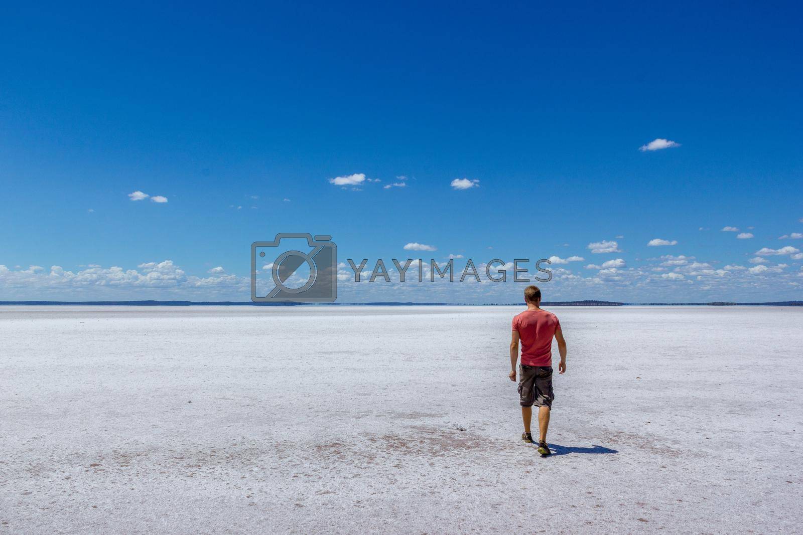 Royalty free image of time to relax for a man walking on a salt lake in western australia by bettercallcurry