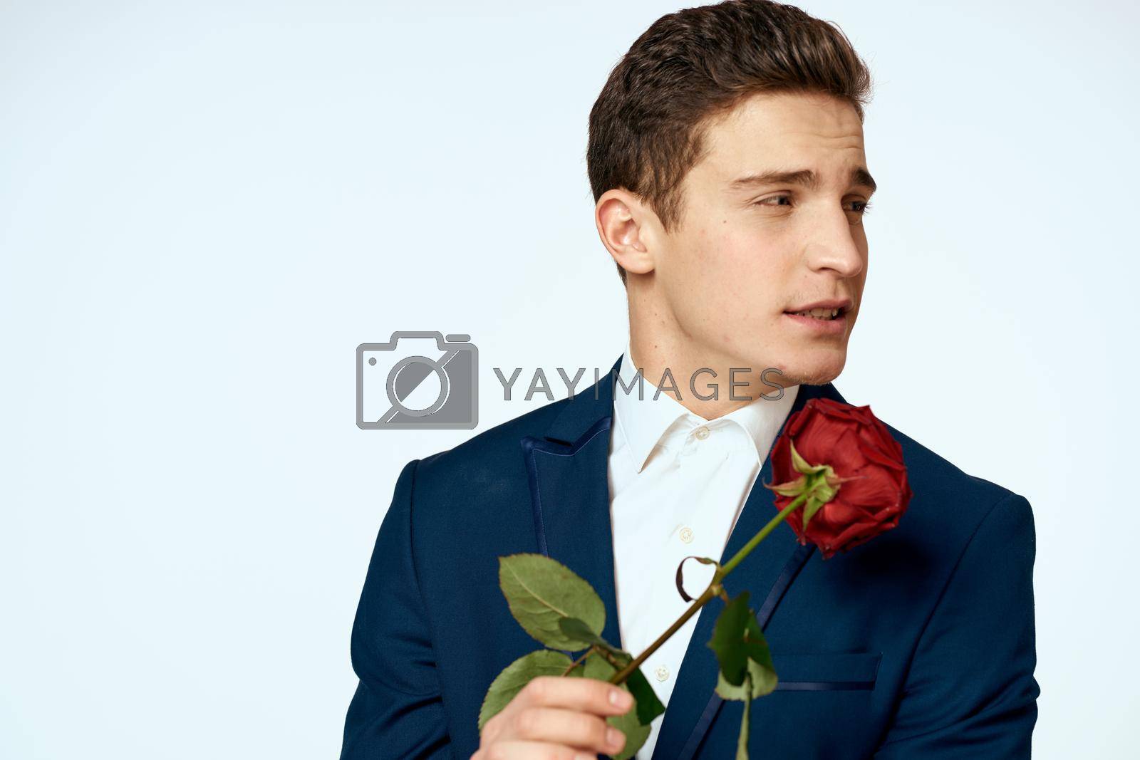 Business man in a flower suit romance date a gift. High quality photo