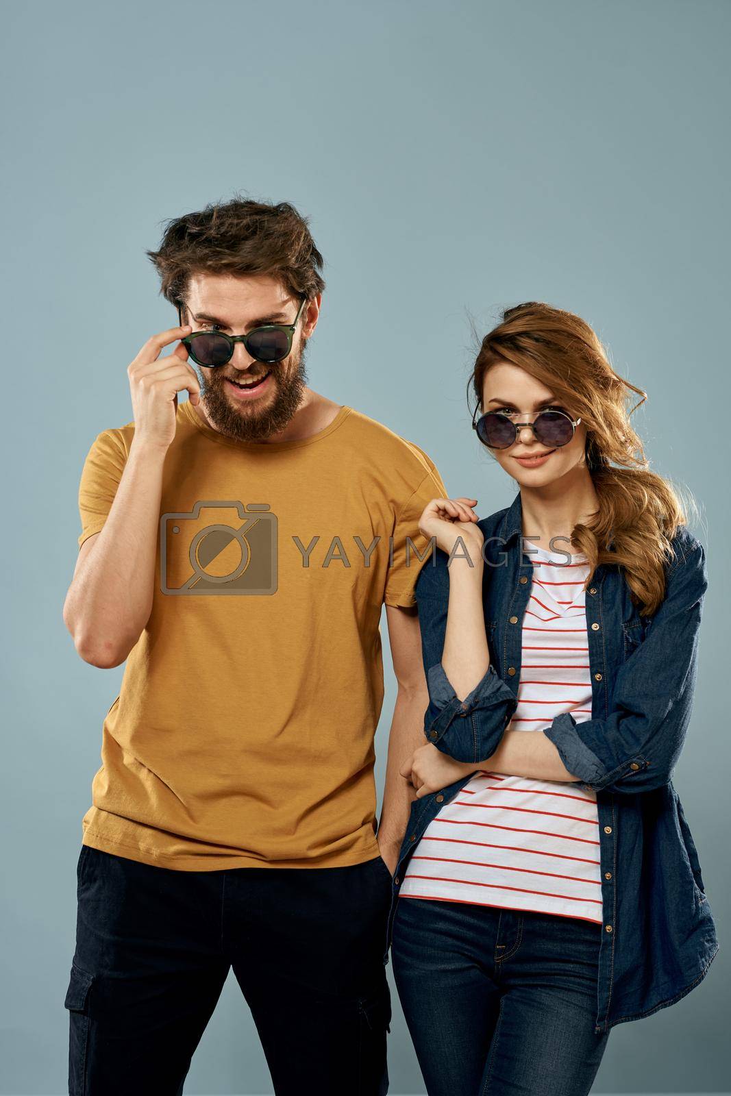 fashion couple emotions fun studio communication blue background. High quality photo