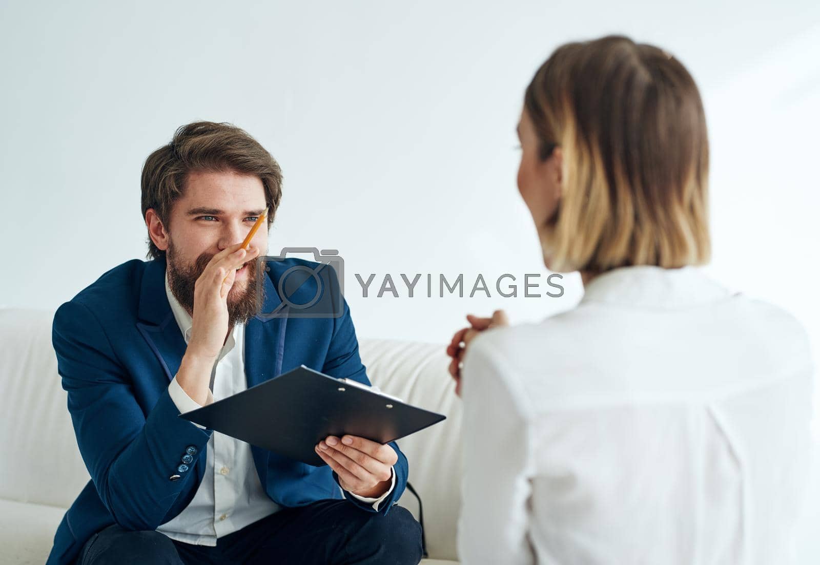 Man and woman sitting on the couch teamwork communication office. High quality photo