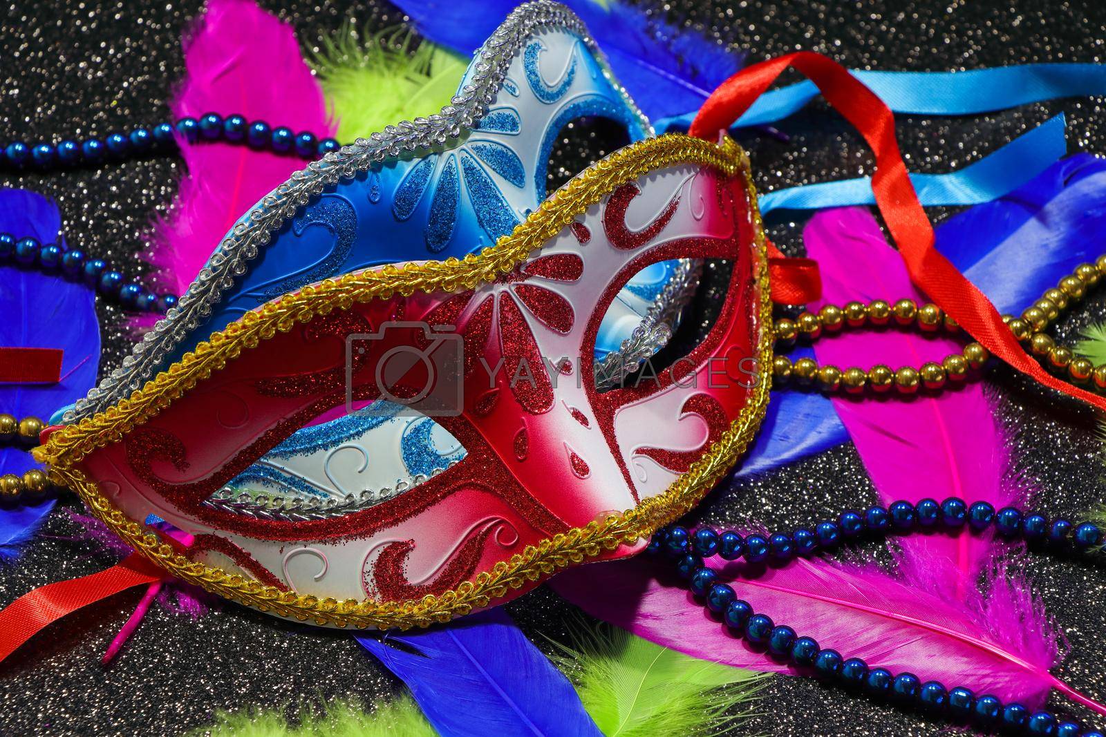 Royalty free image of Pair Of Face Masks With Feathers And Beads by jjvanginkel
