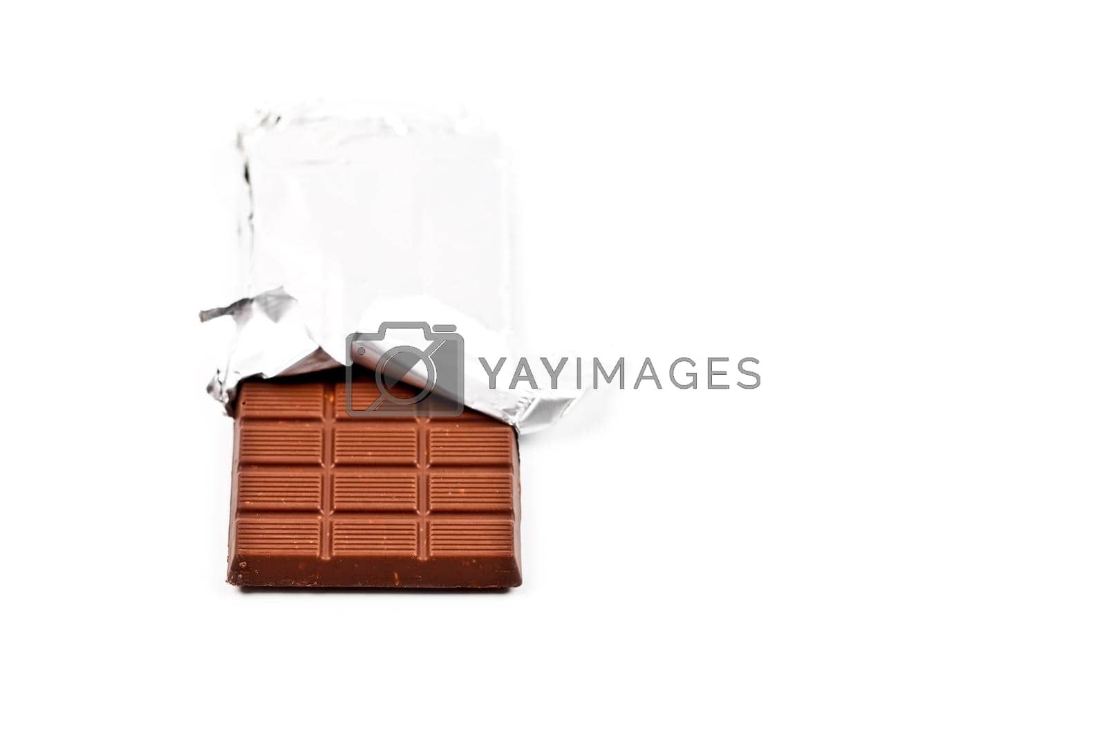 Royalty free image of Chocolate bar in foil isolated on white background. by marylooo